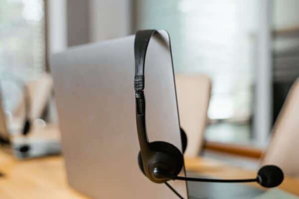 A picture showing a laptop with a VoIP headset