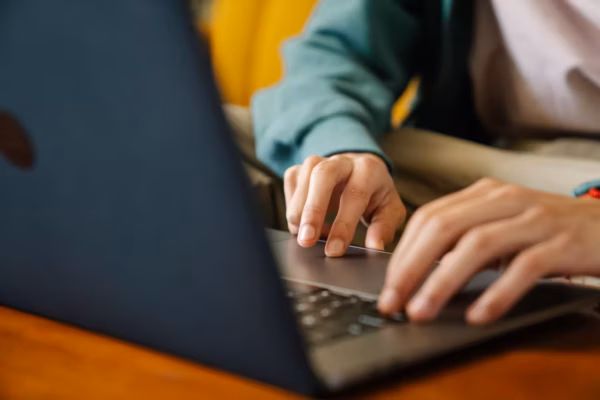 Person sat on laptop computer